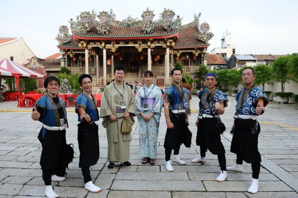 Dagaya of Japan poses in front of Khoo Kongsi Temple at Leong San Tong Khoo Kongsi, Cannon Square, Penang before the welcome dinner at the Penang World Music Festival 2013. - Photograph by Demotix